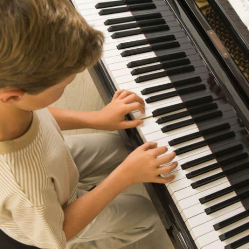 boy playing piano